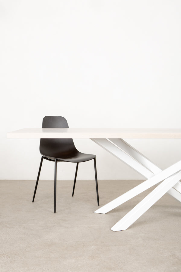 white dining table with sculptural base